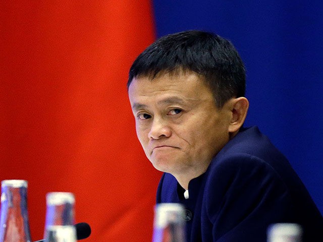 SEATTLE, WA - SEPTEMBER 23: Jack Ma, CEO of Alibaba listens as Chinese President Xi Jinping speaks at a U.S.-China business roundtable, comprised of U.S. and Chinese CEOs on September 23, 2015, in Seattle, Washington. The Paulson Institute, in partnership with the China Council for the Promotion of International Trade, …