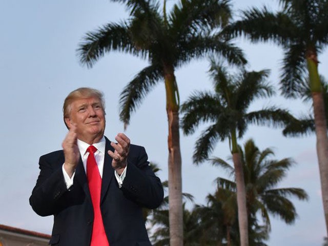 US President Donald Trump watches the Palm Beach Central High School marching band which g