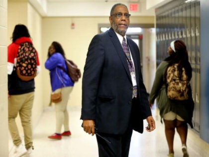 Henry Darby, a high school principal in South Carolina, took a part-time job at Walmart so