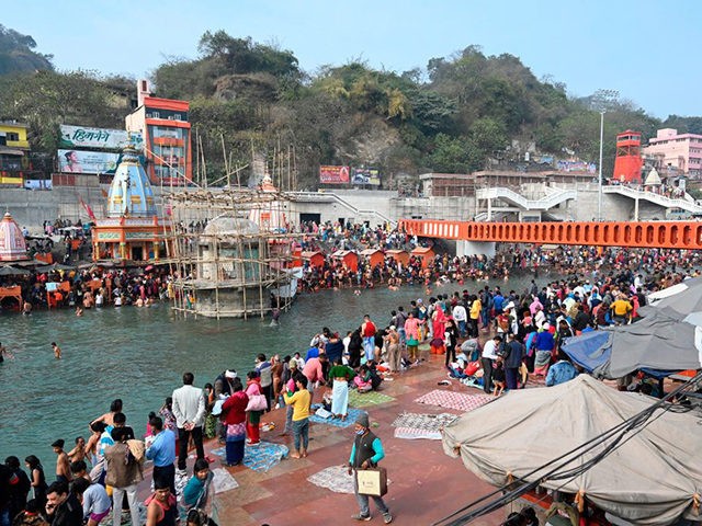 Hindu devotees take a holy dip in the waters of the River Ganges during Makar Sankranti, a