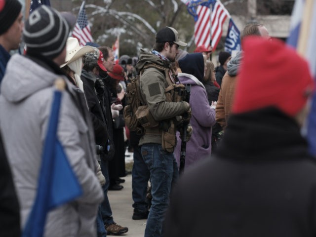 Donald Trump supporters gather around the Michigan State Capitol Building to protest the certification of Joe Biden as the next president of the United states on January 6, 2021 in Lansing, Michigan. Trump supporters gathered at state capitals across the country to protest today's ratification of President-elect Joe Biden's Electoral …