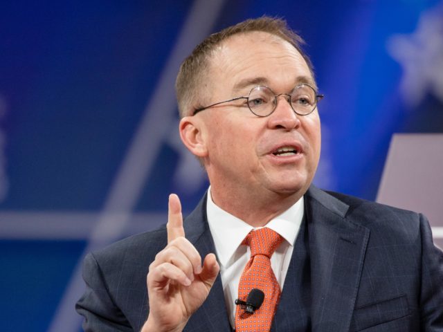 NATIONAL HARBOR, MD - FEBRUARY 28: Acting White House Chief of Staff Mick Mulvaney has a c