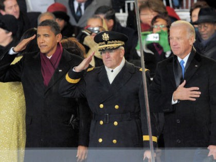 US President Barack Obama (L), US Army General George Casey (C) and US Vice President Joe Biden watch the inaugural parade from the reviewing stand in from of the White House in Washington, DC, January 20, 2009. AFP PHOTO/Mandel NGAN (Photo credit should read MANDEL NGAN/AFP via Getty Images)