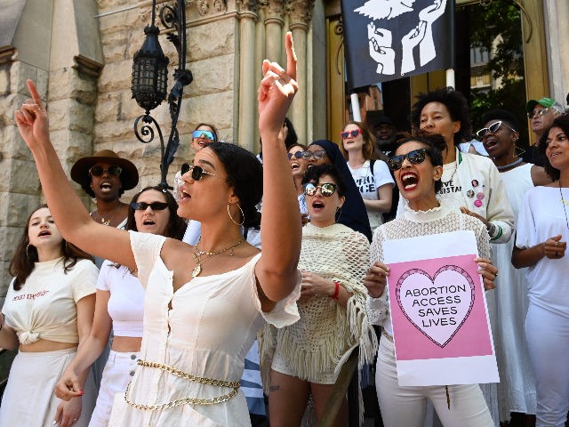 Women from the Resistance Revival Chorus take part in an abortion rights rally in front of