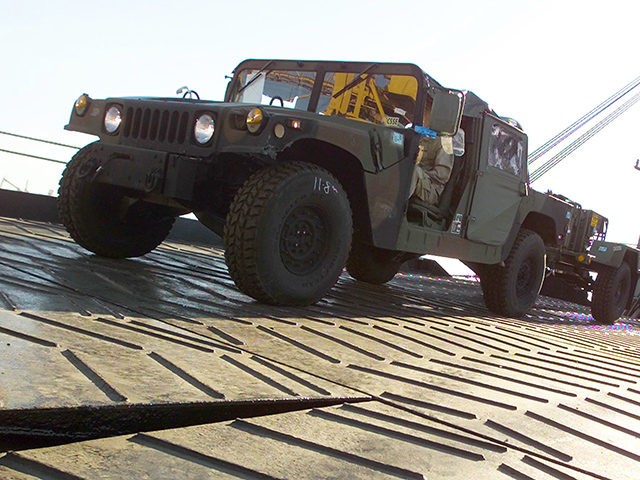 KUWAIT - JANUARY 17: A military Humvee is driven off a ship January 17, 2003 in an undisclosed area of Kuwait. U.S. Marines offloaded equipment for the 1st Marine Expeditionary Force currently deployed in Kuwait. (Photo by Bill Lisbon/U.S. Marine Corps/Getty Images)