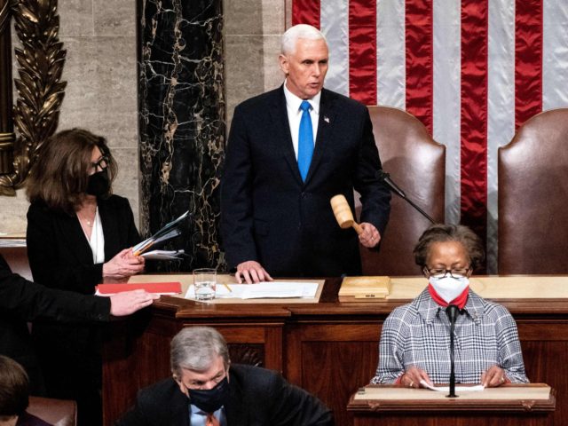 Vice President Mike Pence and House Speaker Nancy Pelosi preside over a Joint session of Congress to certify the 2020 Electoral College results after supporters of President Donald Trump stormed the Capitol earlier in the day on Capitol Hill in Washington, DC on January 6, 2020. - Members of Congress …