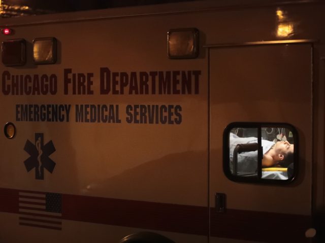 CHICAGO, IL - JANUARY 01: A man is pictured in an ambulance at the scene where two people