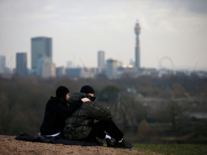 LONDON, ENGLAND - JANUARY 15: People sit at Primrose Hill on January 15, 2021 in London, U