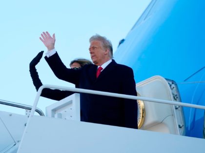 US President Donald Trump and First Lady Melania Trump wave as they board Air Force One at Joint Base Andrews in Maryland on January 20, 2021. - President Trump travels to his Mar-a-Lago golf club residence in Palm Beach, Florida, and will not attend the inauguration for President-elect Joe Biden. …