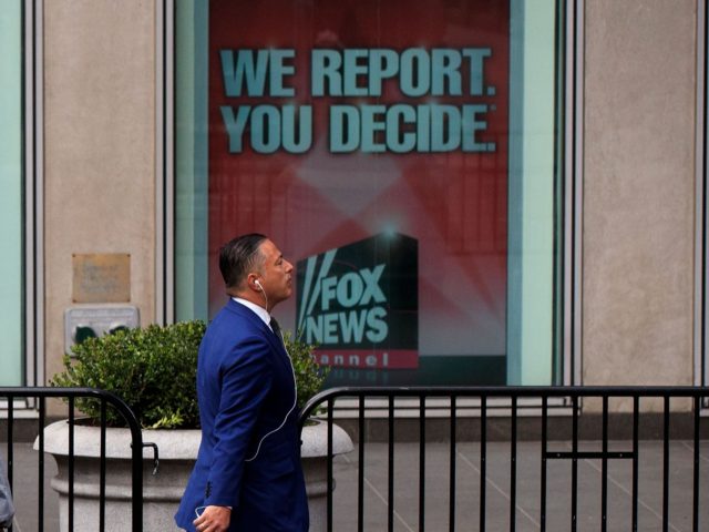 NEW YORK, NY - APRIL 19: People walk past advertisements for Fox News and Bill O'Reilly ou