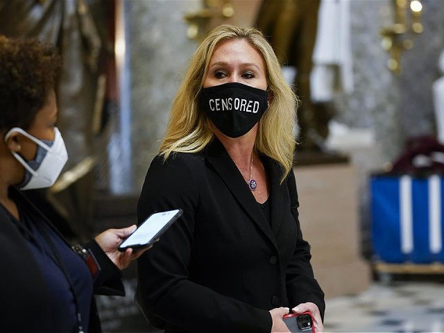 Rep. Marjorie Taylor Greene, R-Ga., walks on Capitol Hill in Washington, Wednesday, Jan. 1