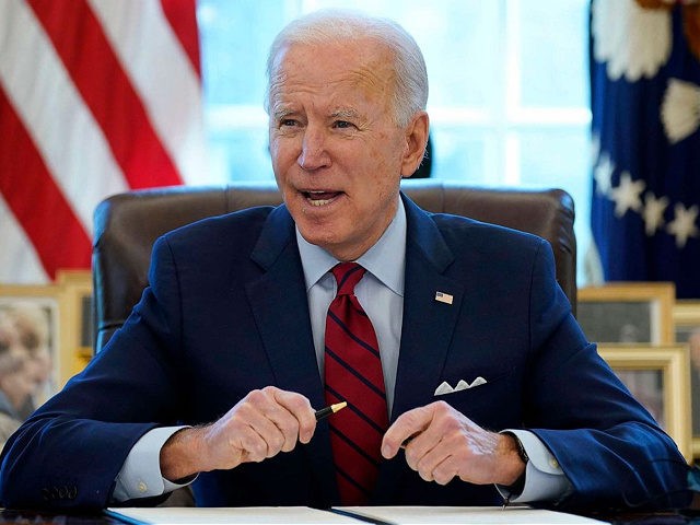 President Joe Biden signs a series of executive orders on health care, in the Oval Office