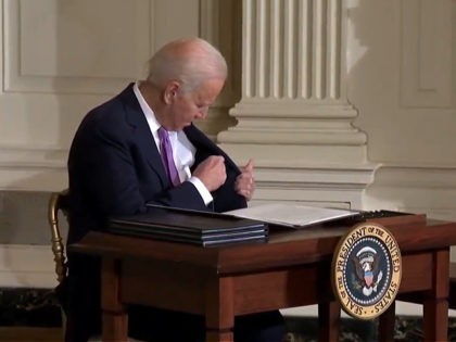Watch: Joe Biden Struggles to Put His Pen in His Pocket