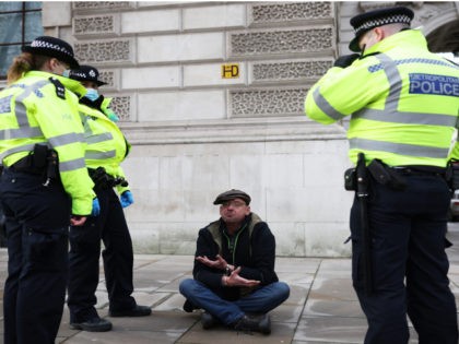 LONDON, ENGLAND - JANUARY 06: An anti-lockdown protester is arrested by police officers in