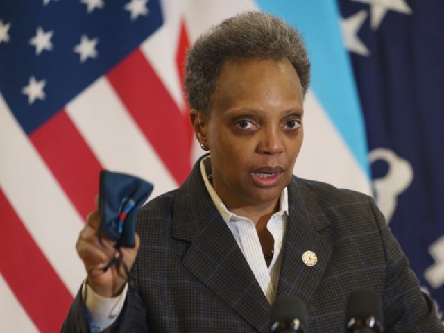 Mayor Lori Lightfoot emphasizes the importance of wearing a mask as she provides an update about the COVID-19 vaccinations at Norwegian American Hospital in Chicago on Tuesday, Jan. 5, 2021. (Youngrae Kim/Chicago Tribune via AP, Pool)
