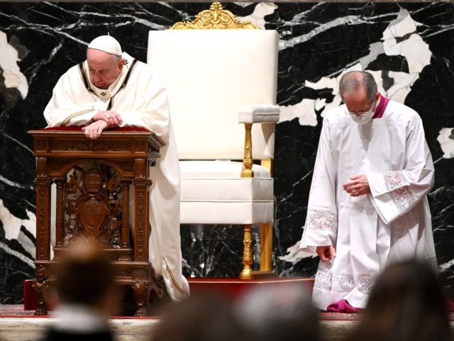 Pope Francis (L) prays as he leads a Christmas Eve mass to mark the nativity of Jesus Christ on December 24, 2020, at St Peter's basilica in the Vatican, amidst the Covid-19 pandemic, caused by the novel coronavirus. (Photo by Vincenzo PINTO / POOL / AFP) (Photo by VINCENZO PINTO/POOL/AFP …