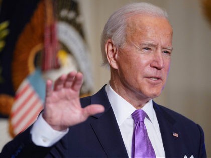 US President Joe Biden speaks on Covid-19 response in the State Dining Room of the White H