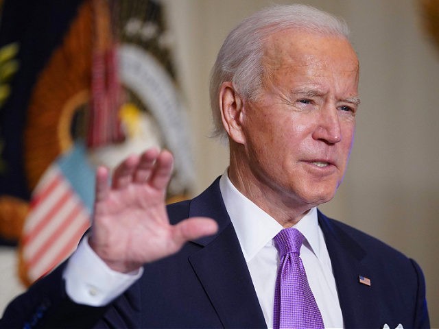 US President Joe Biden speaks on Covid-19 response in the State Dining Room of the White House in Washington, DC on January 26, 2021. - The number of confirmed coronavirus cases around the world on January 26 passed 100 million since the start of the pandemic, according to an AFP …