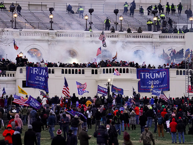 Violent protesters, loyal to President Donald Trump, storm the Capitol, Wednesday, Jan. 6, 2021, in Washington. It's been a stunning day as a number of lawmakers and then the mob of protesters tried to overturn America's presidential election, undercut the nation's democracy and keep Democrat Joe Biden from replacing Trump …