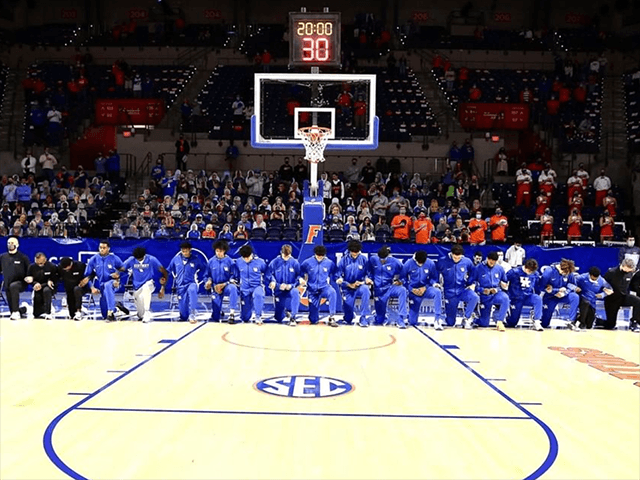 University of Kentucky men's basketball team takes a knee during National Anthem on January 9, 2021