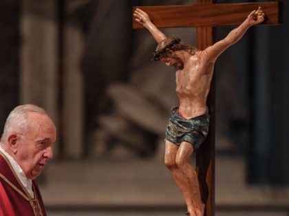 Pope Francis watches a crucifix during the Celebration of the Lord's Passion on Good Frida