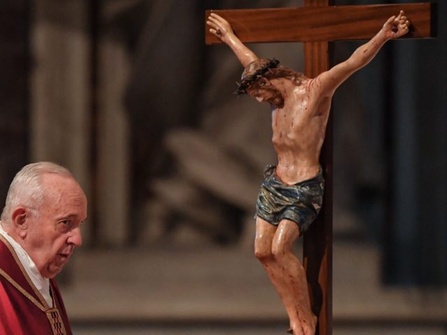 Pope Francis watches a crucifix during the Celebration of the Lord's Passion on Good Frida