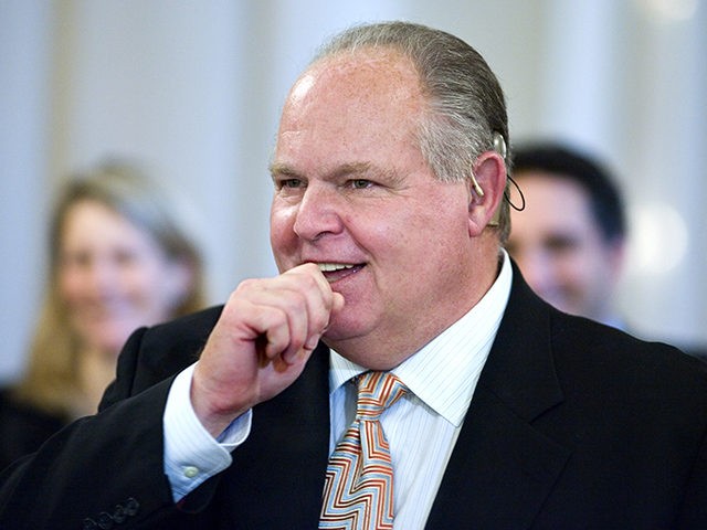 Conservative talk radio host Rush Limbaugh attends a ceremony in the East Room of the Whit