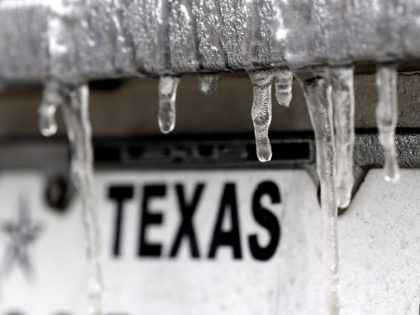 Icicles hang off the front of a vehicle as the temperature continues to fall below freezing Tuesday, Jan. 16, 2018, in Houston. Hundreds of flights have been canceled in Texas, where frigid temperatures have left runways and roads dangerously icy. The National Weather Service issued a winter storm warning for …