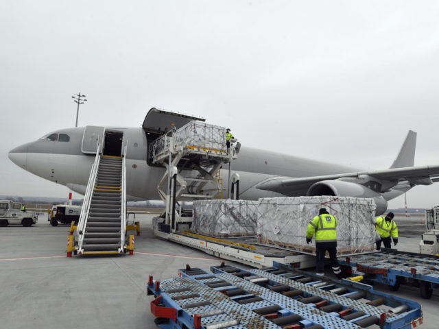 Boxes containing vaccines are unloaded from a Hungarian Airbus 330 cargo plane as the first batch of the vaccine against the new coronavirus produced by Sinopharm of China arrives at Budapest Liszt Ferenc International Airport in Budapest, Hungary, Tuesday, Feb. 16, 2021. The vaccine will not be used without its …