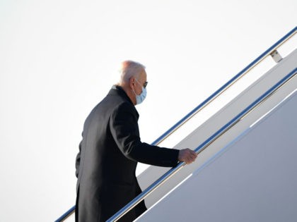 US President Joe Biden boards Air Force One before departing from New Castle Airport in New Castle, Delaware on February 8, 2021. - Biden is returning to Washington, DC after spending the weekend in Wilmington, Delaware. (Photo by MANDEL NGAN / AFP) (Photo by MANDEL NGAN/AFP via Getty Images)