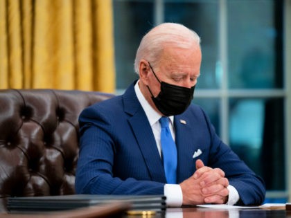 President Joe Biden looks down as he talks about the FBI agents killed in Sunrise, Fla., during an event on immigration in the Oval Office of the White House, Tuesday, Feb. 2, 2021, in Washington. (AP Photo/Evan Vucci)