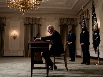 WASHINGTON, DC - JANUARY 27: U.S. President Joe Biden signs executive orders after speakin
