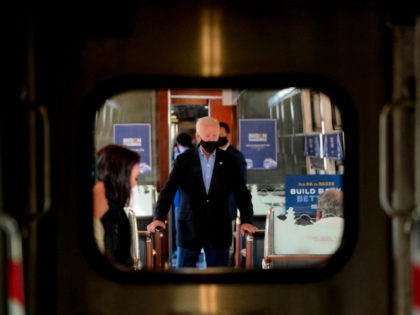 Democratic presidential candidate former Vice President Joe Biden speaks with United Steelworkers Union President Thomas Conway and school teacher Denny Flora of New Castle, Pa., aboard his train as it travels to Pittsburgh, Wednesday, Sept. 30, 2020. Biden is on a train tour through Ohio and Pennsylvania today. (AP Photo/Andrew …