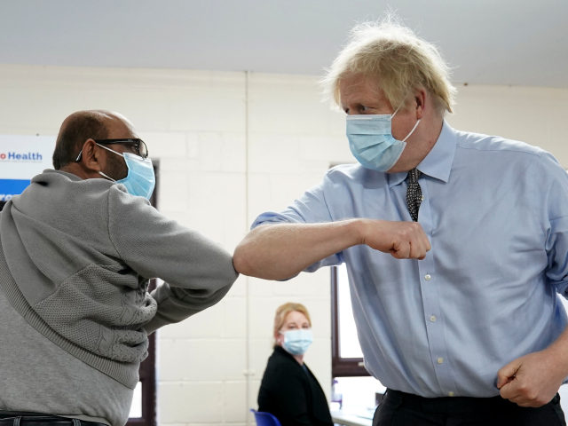 BATLEY, UNITED KINGDOM - FEBRUARY 1: Prime Minister Boris Johnson elbow bumps Ismail Patel
