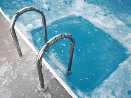 Ice swimming theme. Steps in the frozen blue pool ice-hole