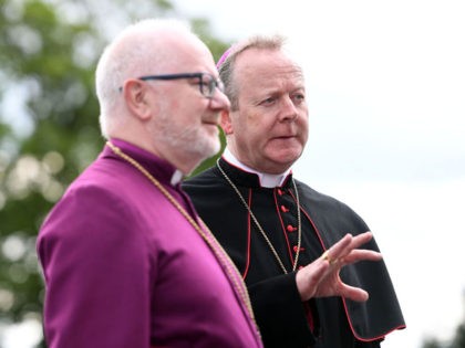 ARMAGH, NORTHERN IRELAND - MAY 22: Archbishop Richard Clarke (left) and Archbishop Eamon Martin look on during a visit by Prince Charles, Prince of Wales to St Patrick's Catholic Grammar School, on the second day of his visit to Northern Ireland, on May 22, 2019 in Armagh, Northern Ireland. (Photo …