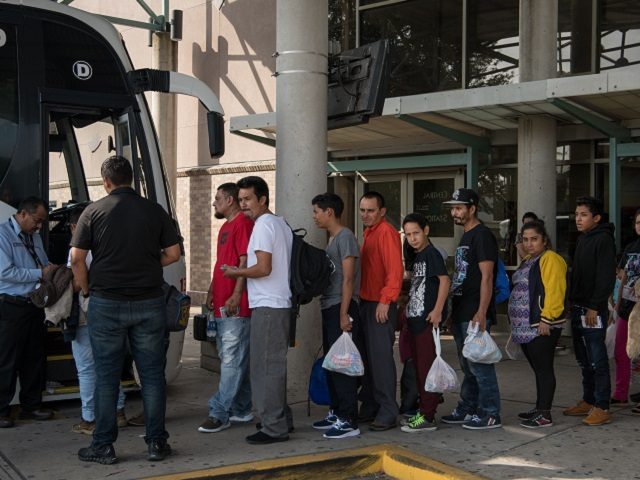 Central American migrant families recently released from federal detention wait to board a bus at a bus depot on June 12, 2019, in McAllen, Texas. (Photo by Loren ELLIOTT / AFP) (Photo credit should read LOREN ELLIOTT/AFP via Getty Images)