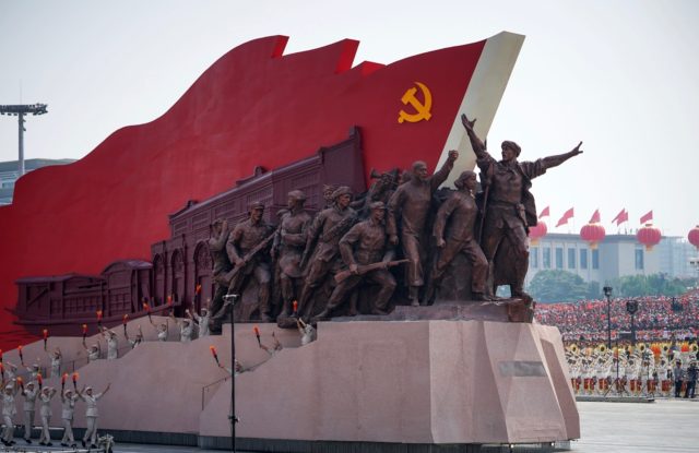 BEIJING, CHINA - OCTOBER 01: A float featuring the hammer and sickle is seen during a parade to celebrate the 70th Anniversary of the founding of the People's Republic of China in 1949, at Tiananmen Square on October 1, 2019 in Beijing, China. (Photo by Andrea Verdelli/Getty Images)