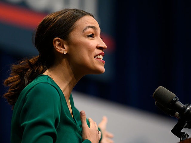 DES MOINES, IA - NOVEMBER 09: U.S. Rep. Alexandria Ocasio-Cortez (D-NY) takes the stage before speaking at the Climate Crisis Summit at Drake University on November 9, 2019 in Des Moines, Iowa. Ocasio-Cortez joined Democratic Presidential candidate Bernie Sanders (I-VT) to spoke about the current state of climate change in …