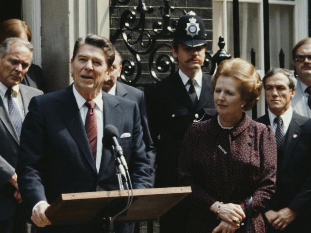 US President Ronald Reagan makes a speech outside 10 Downing Street during a state visit to London, UK, 9th June 1982. British Prime Minister Margaret Thatcher is standing to the right and US Secretary of State Alexander Haig is behind and to the left of Reagan. (Photo by Fox Photos/Hulton …