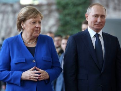 BERLIN, GERMANY - JANUARY 19: German Chancellor Angela Merkel (CDU, L) greets Russian Pres