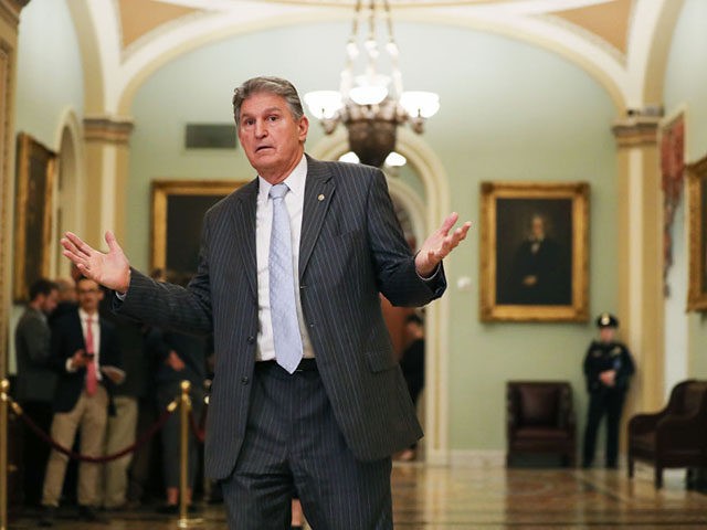 WASHINGTON, DC - JANUARY 24: Sen. Joe Manchin (D-WV) gestures outside the Senate chamber during a recess in impeachment trial proceedings against President Donald Trump at the U.S. Capitol on January 24, 2020 in Washington, DC. House Democrats will wrap up opening arguments on day 4 of the Senate impeachment …