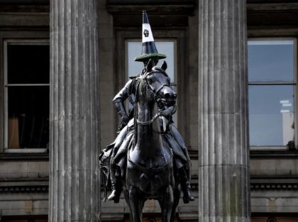The iconic statue of the Duke of Wellington sports a traffic cone with a Black Lives Matter logo, in Royal Exchange Square, Glasgow, Scotland on June 12, 2020. - Authorities in London boarded up memorials including a statue of British wartime leader Winston Churchill on Friday amid fears of clashes …