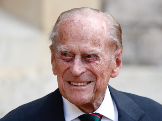 Britain's Prince Philip (C), Duke of Edinburgh takes part in the transfer of the Colonel-i