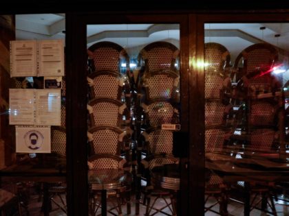 A picture taken on October 5, 2020 in Paris shows piled up chairs inside a closing bar amid new measures to fight the rapid spread of Covid-19. - Bars and cafes in Paris and its nearest suburbs will be shut from October 6 as the capital is placed on maximum …