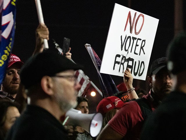 PHOENIX, AZ - NOVEMBER 04: A no voter fraud sign is displayed by a protester in support of President Donald Trump at the Maricopa County Elections Department office on November 4, 2020 in Phoenix, Arizona. The rally was organized after yesterday's vote narrowly turned for Democrats in the presidential and …