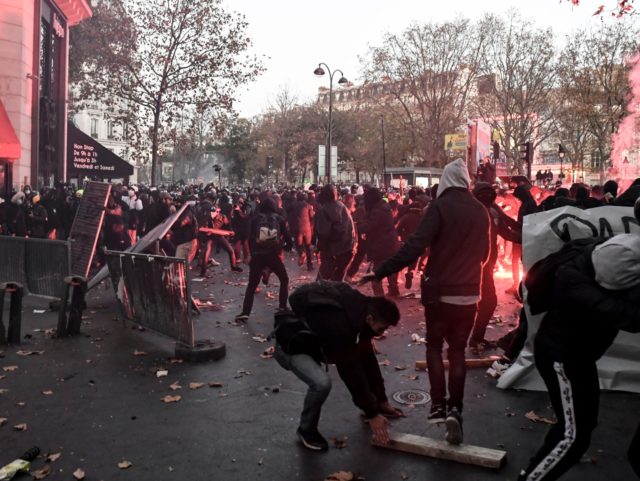 Demonstrators clashes with French riot police during a protest against the 'global se