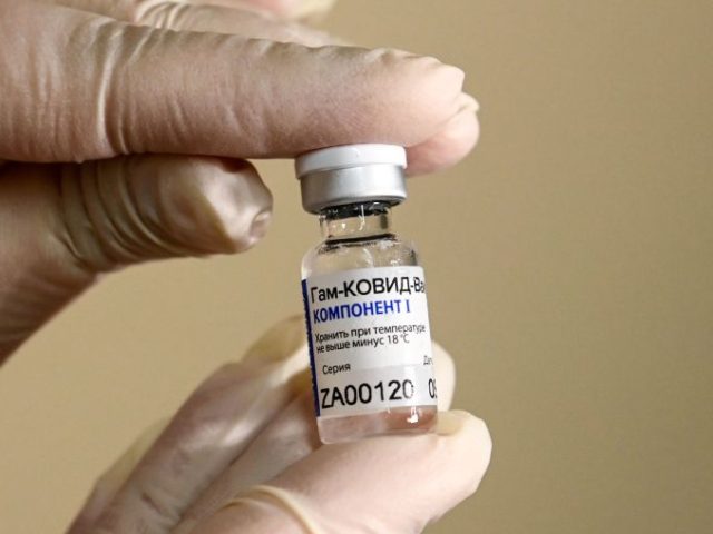 TOPSHOT - A nurse shows the Sputnik V (Gam-COVID-Vac) vaccine against the coronavirus dise