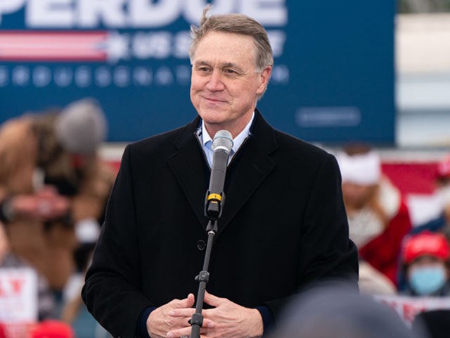 COLUMBUS, GA - DECEMBER 11: U.S. Senator David Perdue speaks at a Defend The Majority campaign event attended by U.S. Vice President Mike Pence on December 17, 2020 in Columbus, Georgia. Sen. David Perdue and Sen. Kelly Loeffler are facing a January 5 runoff election in Georgia. (Photo by Elijah …
