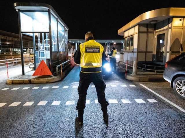 A picture taken on December 22, 2020 in Malmo, Sweden, shows control patrols and vehicles at the border crossing on the Oresund Bridge, which connects Denmark and Sweden (Copenhagen and Malmö). - Sweden blocked travel from neigbouring Denmark starting midnight on December 22, 2020, after a new mutation of the …